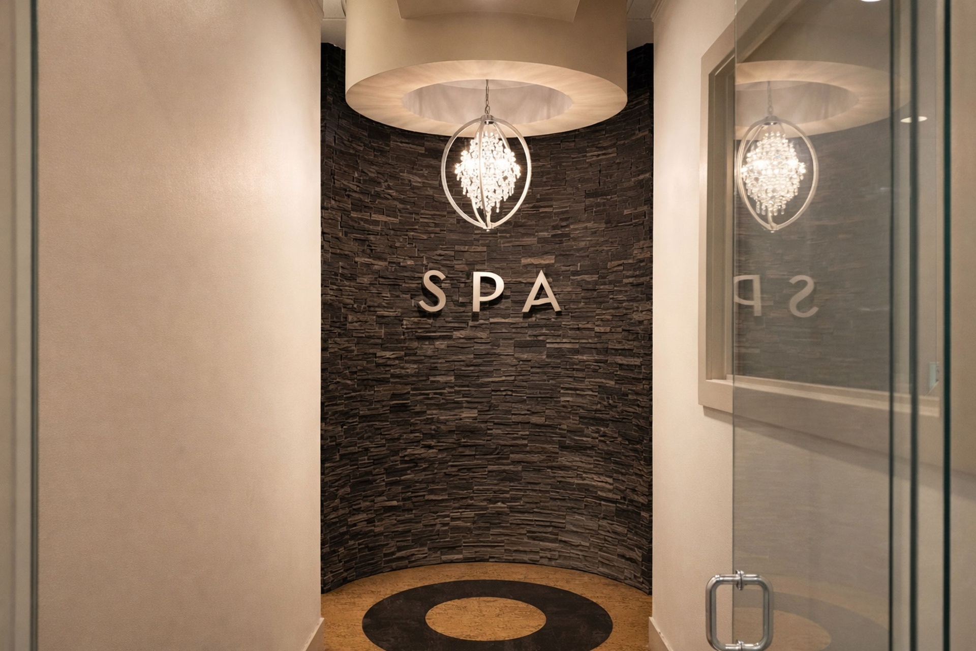 Spa entrance with stacked stone wall and chandelier